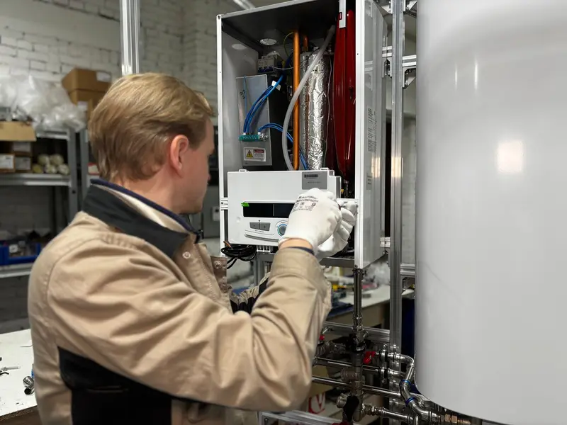 Water heater installation in Miami: technician servicing a heater